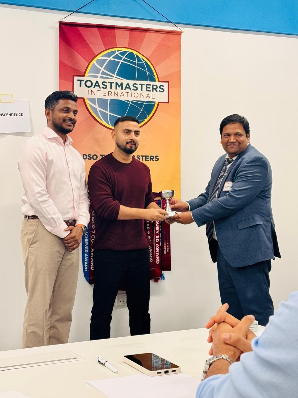 Mohammad Parwez receiving the Best Speaker trophy at DSO Toastmasters Club, Dubai